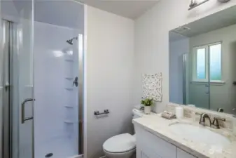 The ensuite bath features a new vanity and walk-in shower.
