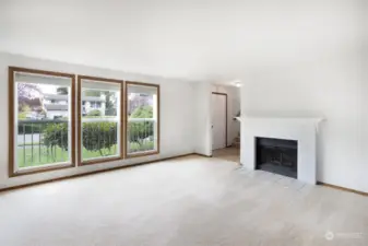 Living room with real wood fireplace.