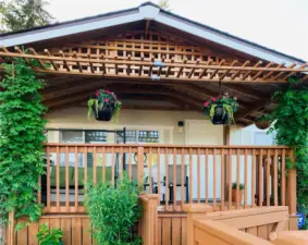 Relax on your huge covered cedar deck, that's especially lovely when the flowers and greenery are in bloom!