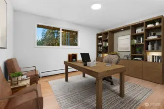 Main floor office or bedroom. (digitally staged)