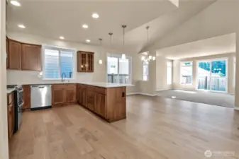 Looking over Kitchen towards dining and living rooms. Photo from similar plan on a different lot for reference only