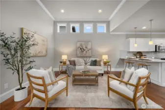 The great room offers vaulted ceilings, crown molding and lots of natural light.