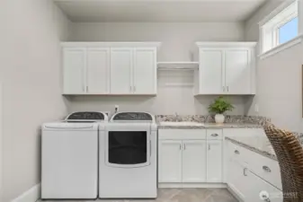 Washer and dryer stay with the home.  The utility sink comes in handy!