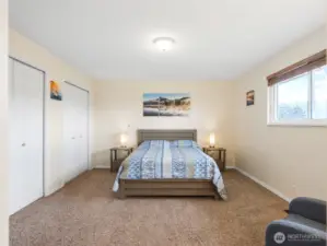 Primary bedroom with double closets.