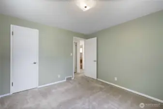 Main floor front bedroom/office, entry and closet door