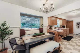 Dining nook with backyard views, just steps from the kitchen—ideal for everyday meals or entertaining."