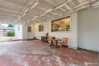 Covered patio area offering shade and year-round outdoor living space