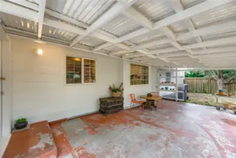 Second view of the covered patio, highlighting its generous size and versatile outdoor living potential