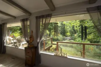 huge Livingroom windows overlooking the river and creek merging