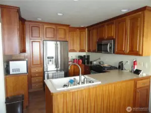 Kitchen with natural wood colored cabinets