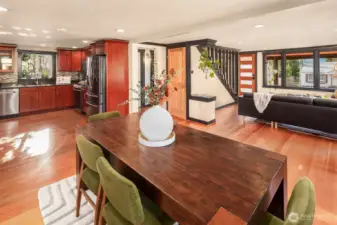 Such a wonderful home for entertaining with so much communal space. The door shown leads to the unfinished basement, and just beyond that is a bathroom and bedroom.