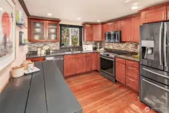 The updated kitchen is bright and spacious, with stainless appliances.