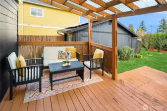 The seating area that takes up only one side of the covered back deck