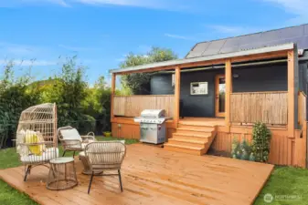 There is a sweet patio in addition to the covered deck. So much great use of space in the yard!