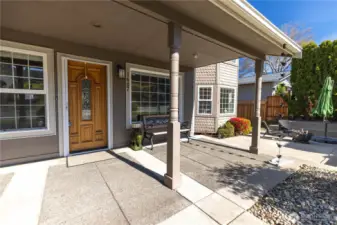 Spacious front patio with room for firepit and outdoor furniture