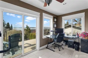 This bonus room off the primary is perfect for office & gym with gorgeous views.