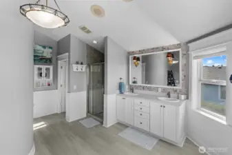 Primary bath with double sinks, walk-in, tiled shower and plumbed for tub.