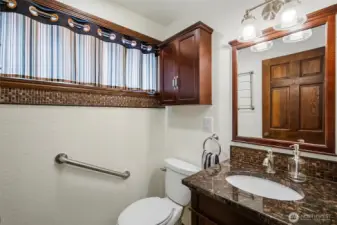 Main floor bathroom with adjacent shower.