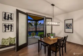 Big dining area has french doors opening to covered outdoor living space