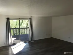 Living area with sliding door to deck to enjoy the view