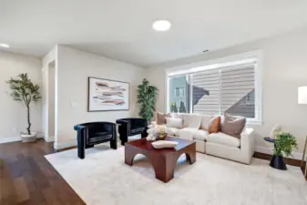 Another view of the living room. On the far left is the access to the powder room.