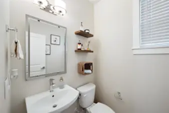 Powder bath on the first floor, off of the cozy living room.