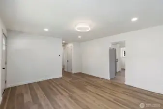 View from the living room to kitchen and hallway to the office and the bedrooms.