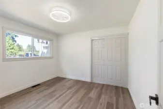 2nd bedroom located at the front of the home across from the hallway bathroom.
