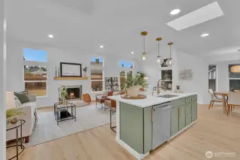 Vaulted ceilings with skylights and expansive windows flood this main living area with natural light throughout the day.