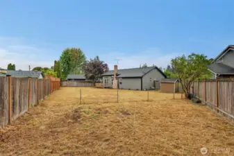 Fully fenced for privacy and security, the large lot provides endless possibilities for outdoor activities and landscaping.