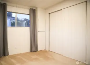 Another view of the second bedroom with a spacious closet for ample storage.
