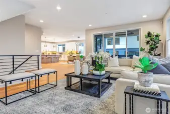 Open-concept great room seamlessly connected to the kitchen and dining areas — light filled and designed for effortless everyday living