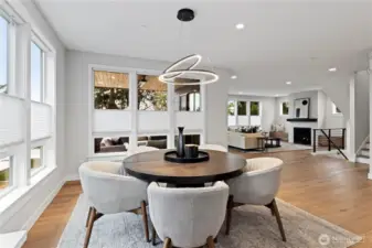 Bright dining space overlooking the covered outdoor living and great room — easy, comfortable gathering space in the heart of the home.”