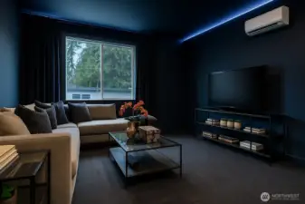 Virtual Staging: Imagine this room as a dramatic navy home theater with blackout drapes and LED lighting for movie nights and gaming