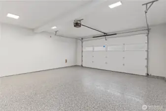 Pro-grade epoxy flooring, bright LED lighting, and plenty of room for two vehicles plus an additional storage room.