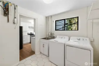 Lower laundry has utility sink