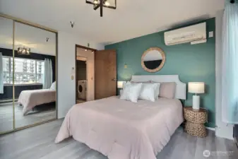 Both the bedroom and the living room have mini-split AC units.