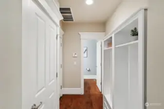 Convenient hallway leads to 1/2 bath and 3 car garage.