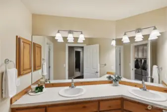 Double vanity is separate from shower area providing flexible use for guests