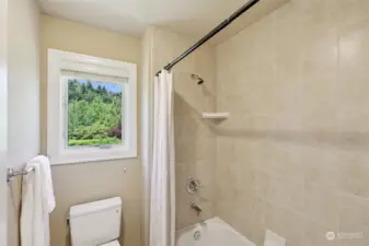 Separate bathroom area affords privacy