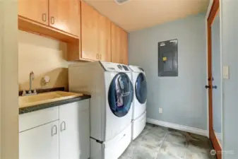 Laundry/mudroom with a door to the back yard.