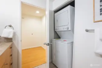 New washer and dryer located in the bathroom.