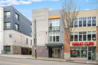 Secure front entrance to the building. The alley that leads to the parking is just to the left. Safeway is located just around the corner.