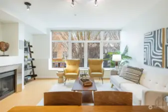 A wall of west-facing windows bathes the home in natural light.