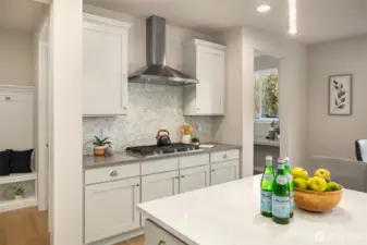 Soft close drawers and drawers throughout the kitchen and upgraded mosaic tile backsplash