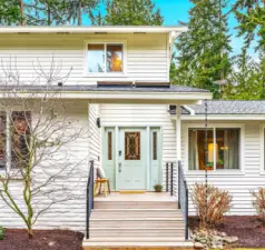 The simple yet charming entryway offers an overflow of curb appeal.