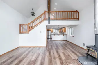 Great room looking back to kitchen and second floor