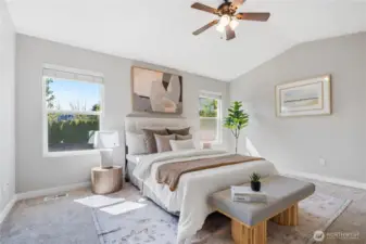 Lovely primary suite features fresh paint , vaulted ceilings, double door entry & en suite full bath with walk-in closet & soaking tub.