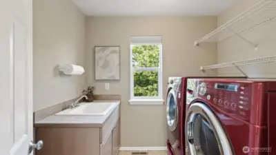 Spacious laundry room with brand new LG washer and dryer - both stay with the home