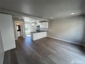 Door left to kitchen leads to powder room